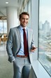 © Yana - Confident businessman in a stylish suit enjoys a moment during a bustling workday, overlooking a vibrant city skyline