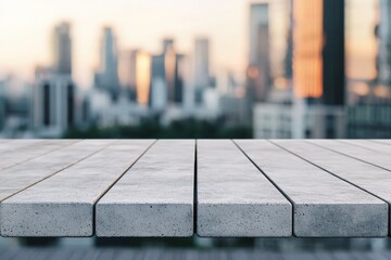 Fototapete - Concrete table overlooking blurred cityscape at sunset: perfect for product placement