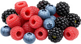 A close up view of a pile of fresh raspberries blueberries and blackberries on a white background