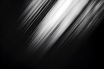 black and white motion blur with diagonal lines creating an abstract texture on a dark background.