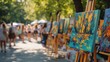 © rifai_art - Outdoor art market in a park.  People browsing paintings
