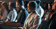 © peopleimages.com - Listening, night and business woman at conference for tech seminar, app launch and quantum computing technology. Innovation, learning and workshop panel with people or audience at expo for ai forum