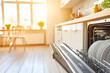 © virtual - Sunlit kitchen with open dishwasher filled with clean dishes, showcasing a modern home environment