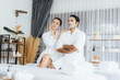 © InfiniteFlow - Serene modern daylight ambiance of spa salon, couple customer indulges in rejuvenating with facial skincare mask. Facial skin treatment and beauty cosmetology procedure for face. Quiescent