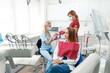 © Astock - teeth whitening, dentist checking teeth, dental examination, patient's teeth, hospital office, ensuring dental health