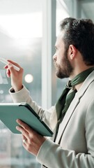 Poster - Glass wall, tablet and writing with business man in office for brainstorming or strategy. planning, reading and sticky notes with professional employee at work for creative development or design