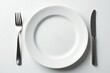 © Hiran - Close-up of empty plate, fork, and glass on white , food, nutrition