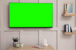 © New Africa - TV set with green screen on white wall in room. Chroma key compositing