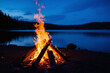 © Bo - bonfire on the shore of a lake at dusk