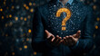© jainul - Businessman holding a question mark icon with a digital network connection in hand, a technology concept background for information data and social media marketing business