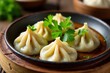 © Udomner - Steamed dumpling with split green chilies and cilantro garnish, steamed, dumplings