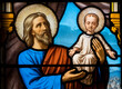 © Joan - Stained glass (19th century) of Saint Joseph holding baby Jesus Christ in his arms.