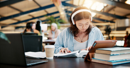 Fototapete - Music, reading book and woman learning in university library for knowledge, research or listen to audio. Notebook, college and serious student with headphones to study for exam or education with tech