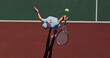 © Mitchell/peopleimages.com - Tennis, serve and woman on outdoor court with challenge, performance and action game from above. Racket, ball and professional athlete at lines for fitness, wellness and competition at sports club