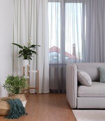 Poster - Window with stylish curtains in living room interior