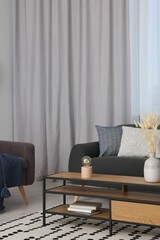 Poster - stylish room interior with comfortable sofa and beautiful window curtains