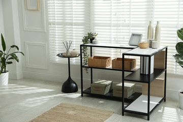 Poster - Console table with different decor near window indoors. Interior design