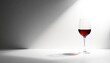 © Thaned - Single red wine glass, against pure white, dramatic lighting, stemware, deep red