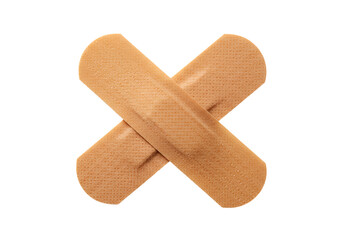 adhesive bandages crossed on a plain surface, medical first aid equipment