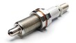 © Collection - Close-up view of a metallic automotive spark plug component isolated on a bright white background