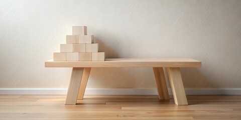 Fototapete - Simple wooden bench with a pyramid of blocks