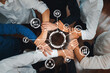 © InfiniteFlow - A diverse group of hands united in collaboration above a circular interface, symbolizing teamwork and innovation in a modern business environment. Amity