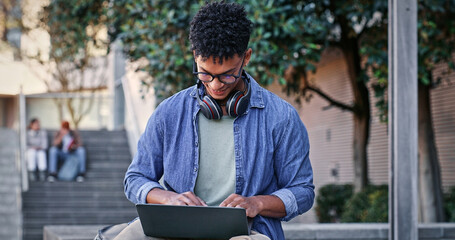 Fototapete - Man, student and typing with laptop outdoor for university project, research and information of education. Smile, male person and glasses with digital for online learning, exam results and studying
