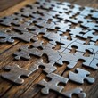 © Espresso - Close-up view of interlocking wooden puzzle pieces on a rustic table, highlighting texture and craftsmanship.