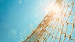 © Ketua - A close-up of a tattered fishing net against a bright blue sky, with sunlight filtering through