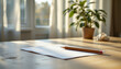 © sunflower24 - Tranquil scene captures wooden table with blank sheet of paper and pencil, illuminated by soft sunlight filtering through sheer curtains. potted plant adds touch of nature, enhancing serene