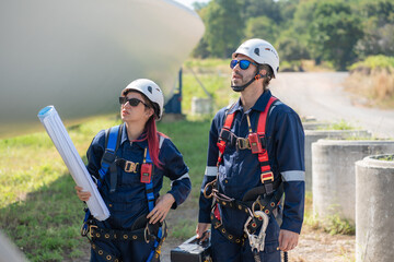 Wall Mural - engineer team working in wind turbine farm. maintenance engineer working in wind turbine.