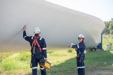 Wall Mural - engineer team working in wind turbine farm. maintenance engineer working in wind turbine.