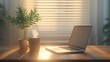 © Lexyat - Laptop, coffee, and plants on a sunny desk