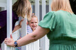 © Austockphoto - Speech therapist professional with girl interacting by cubby house talking and assessing child