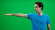 © Fudi - Young Man Presenting on Green Screen