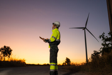 Aufkleber - Engineer man working with tablet at windmill farm Generating electricity clean energy. Wind turbine farm generator by alternative green energy.