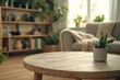 © fabioderby - Empty round wooden coffee table showing cozy living room with plants