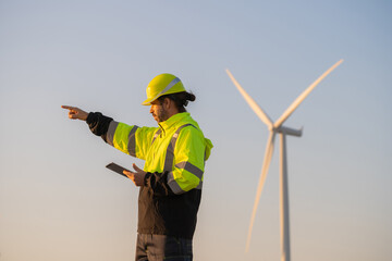 Aufkleber - Engineer man working with tablet at windmill farm Generating electricity clean energy. Wind turbine farm generator by alternative green energy.