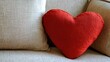 © muhammad - Cozy heart-shaped pillow on a couch