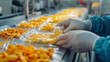 © Fidel - Worker Packing Dried Fruit in a Food Processing Plant