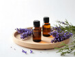 © riddler - Aromatic lavender essential oils composition on a round wooden tray scenery