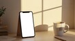 © Kanthowork - Cozy Morning Workspace With Smartphone And Tea Under Soft Natural Light With Empty Screen