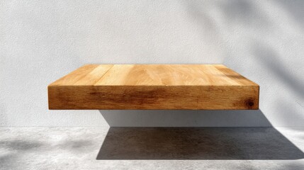 Aufkleber - An empty light-colored wooden platform with natural grain and shadows rests against a plain wall, providing clear space for text or design elements