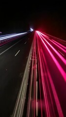 Wall Mural - A long, colorful road with a bright blue stripe. The road is illuminated with neon lights, creating a sense of movement and energy