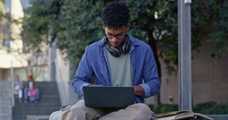 Fototapete - Learning, student and man with books, laptop and research for assignment, scholarship and internet. Person, campus and guy with computer, language project and university with website info and college