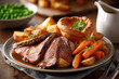 © TP71 - Traditional British Sunday roast dinner with sliced beef, roasted potatoes, carrots, peas, and Yorkshire pudding.