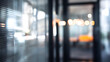 © Ganesha88 - Blurry office interior view with softly lit doorway contemporary workspace modern environment focused feel