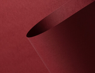 Aufkleber - Matt paper texture with luxury maroon and wine red tones, sleek folded design creating bold contrast. The smooth, deep red surface offers a rich, modern backdrop with natural curves, minimalistic.
