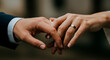 © Rafael - Close-up of a couple holding hands, their wedding rings are on display, symbolizing love, commitment, and the start of a new chapter.