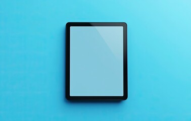 3D render of a black tablet with a blank screen on a blue background, viewed from a top-down angle. A mockup for design and advertising concepts. Black modern touch device mockup. 